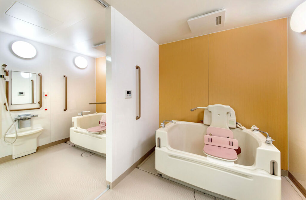 A bathtub installed in a senior care facility, including a seat that makes it easier for the user to move into and out of the bath.